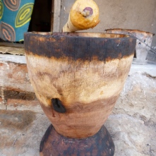 My ibende (mortar and pestle), with sticky mpundu fruit still on the pestle.