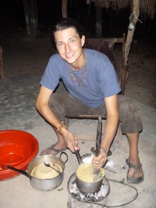 Samuel, displaying his best Zambian hospitality by cooking me ubwali at his site.