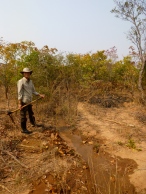 In Samuel's village, a man-made furrow carries water to crops even in the dry season, so people can farm year-round.